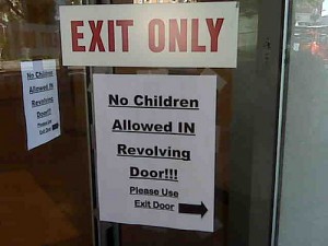 Sign on revolving door