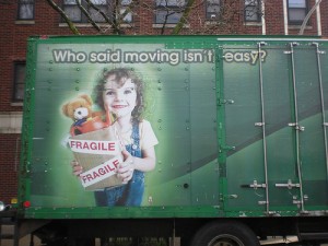 Creepy looking kid on moving truck